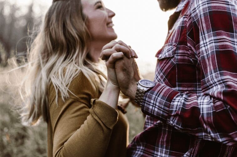 Healthy Relationships - a couple holding hands and looking at each other