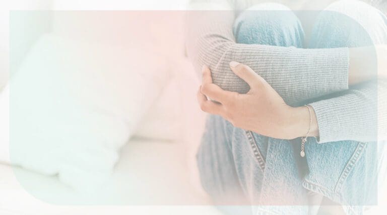 Stuck in a negative thought loop, with Guide Charles Jones. Image shows a person siting in a bed, worried.
