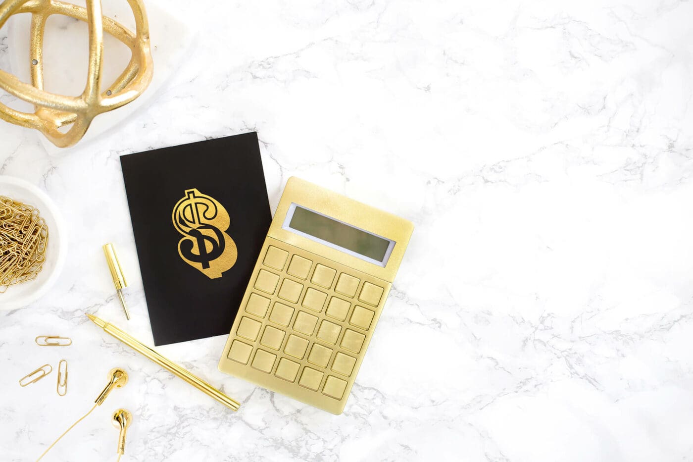 Guide to Pricing Coaching Services - a calculator next to a card with a dollar sign.