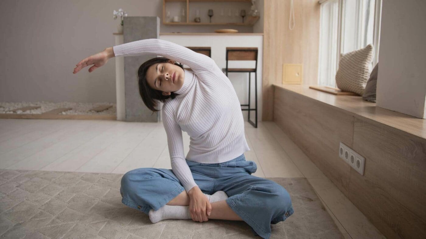 Woman stretching sideways - Yoga Nidra for Better Sleep with Monica Le Baron